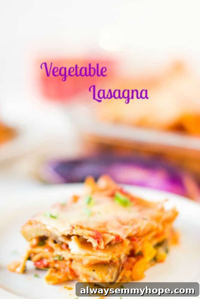 This whole wheat, hearty, loaded Vegetable Lasagna is delicious, cheesy and completely customisable! Perfect for a comforting dinner. A slice of vegetable lasagna on a white plate.