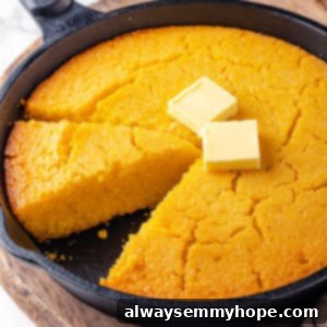 Golden Corn Pone 2 Cast iron skillet with corn pone and pats of butter