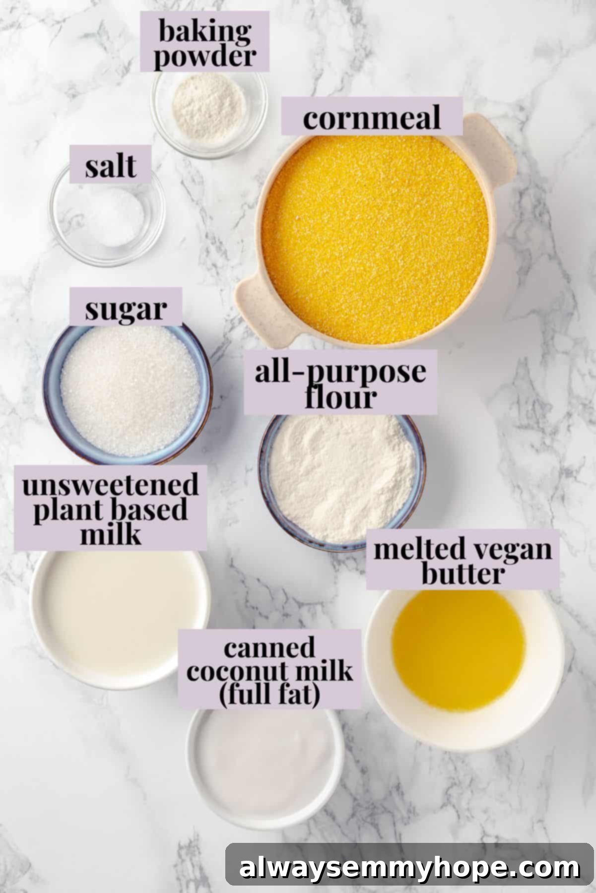 This vegan corn pone is crispy on the outside, tender on the inside, and so delicious! If you like cornbread, you’ll love this recipe. Overhead view of all the plant-based ingredients for corn pone laid out on a kitchen counter