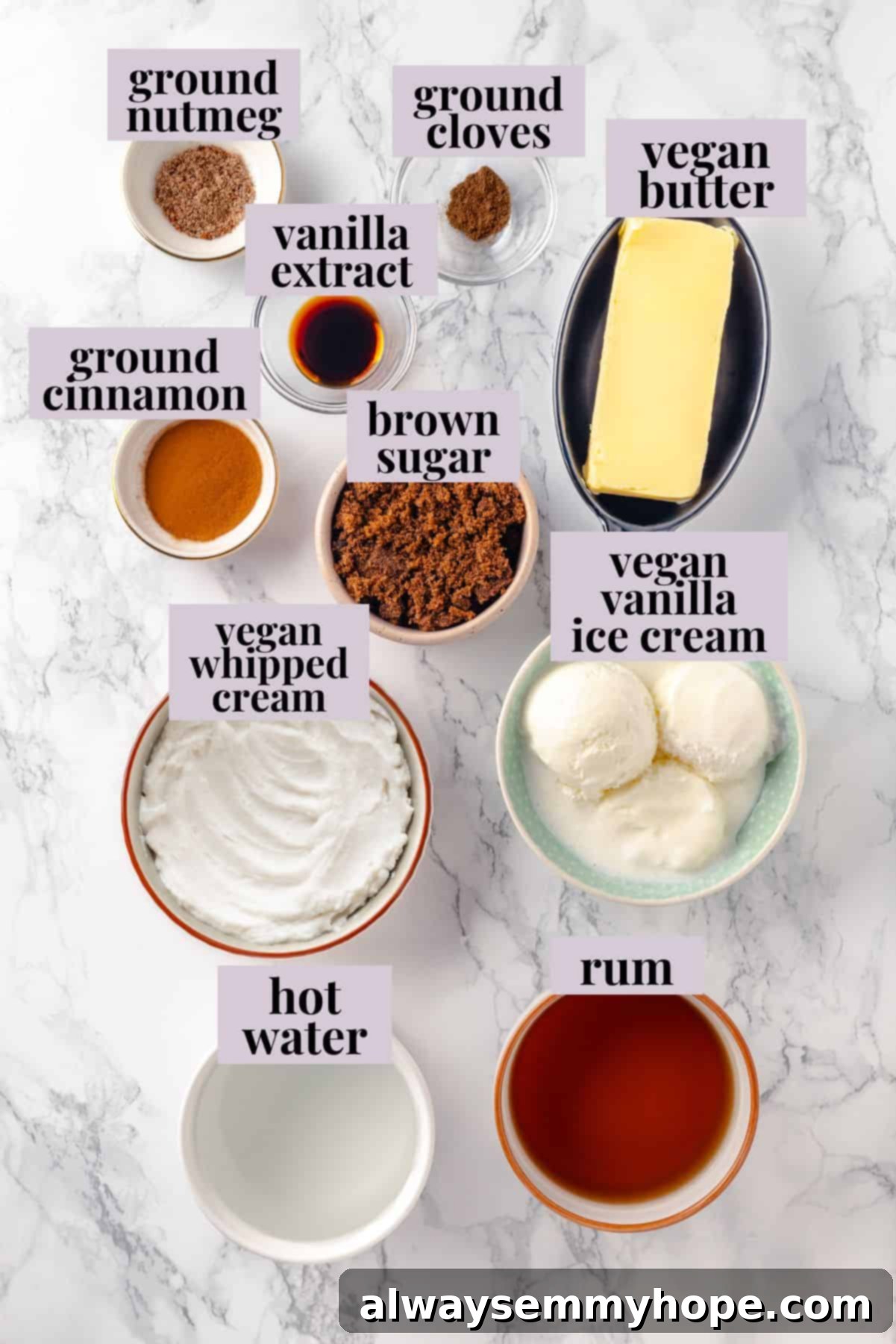 Essential ingredients laid out for a rich, creamy, and spiced vegan hot buttered rum, perfect for warming up this winter. An inviting overhead view showcasing all the simple, wholesome ingredients required to craft the perfect vegan hot buttered rum, highlighting the ease of preparation.