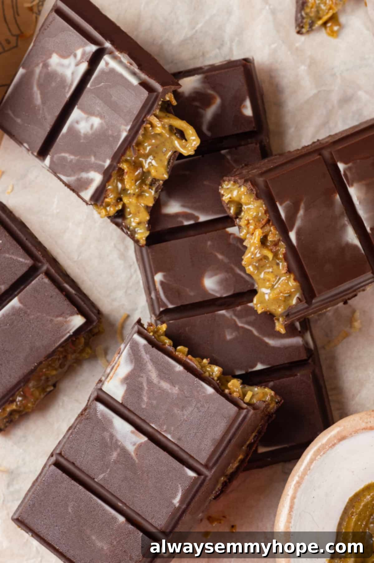 A Dubai chocolate bar is filled with crispy kataifi and a rich, creamy mixture of pistachio and tahini. Here’s how to make them at home! Overhead view of homemade Dubai chocolate bar