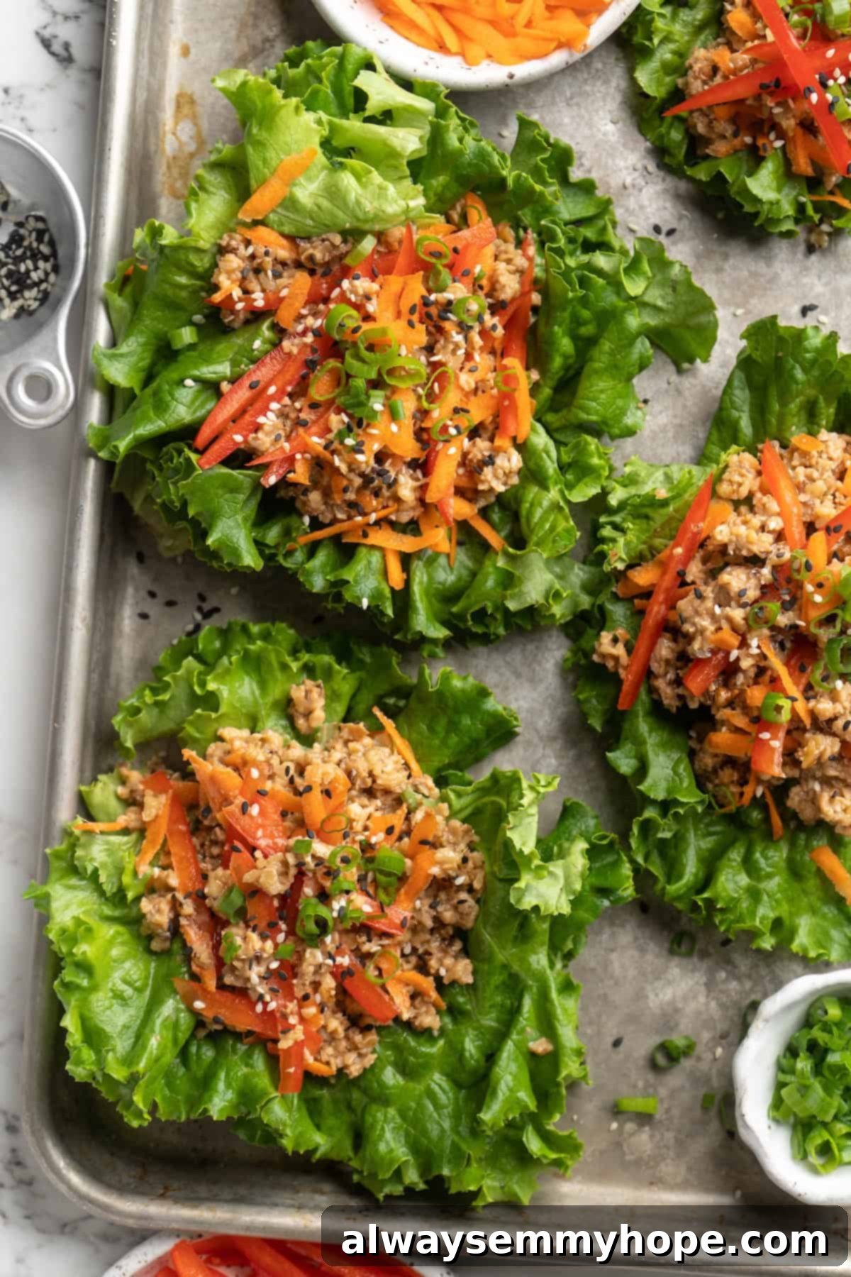 Overhead view of walnut meat lettuce wraps on sheet pan