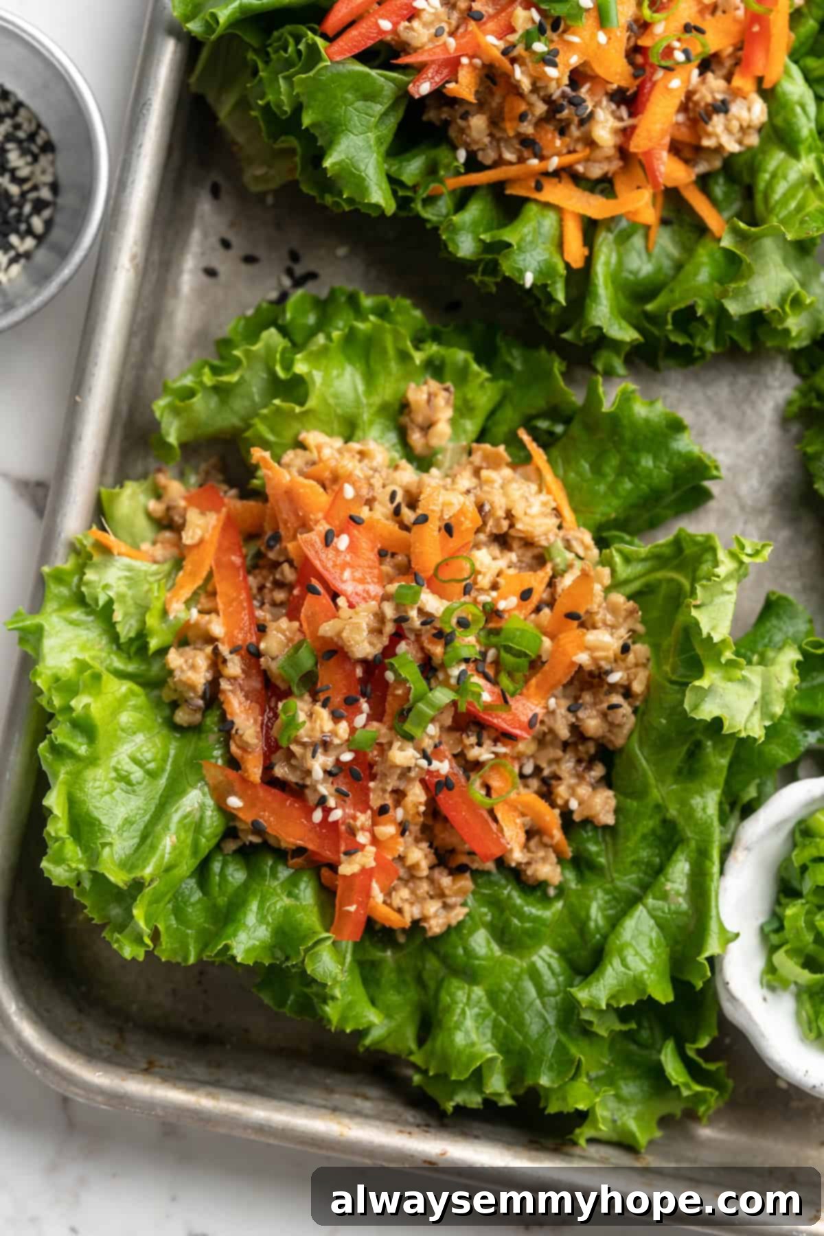 Overhead view of lettuce wraps on sheet pan