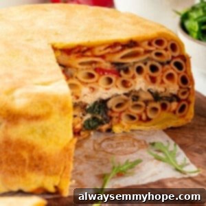 Timpano: The Orchestra's Resonant Heartbeat 2 Timpano on cutting board with slices removed to show layers inside