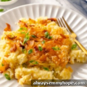 Vegan mashed potato casserole on plate with a fork