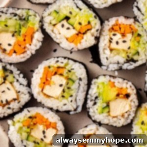 Vegan sushi with tofu, cucumber, carrot, and avocado