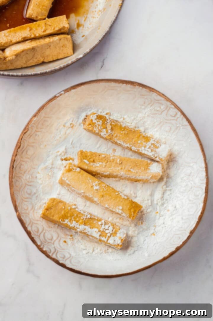 Coating tofu in cornstarch