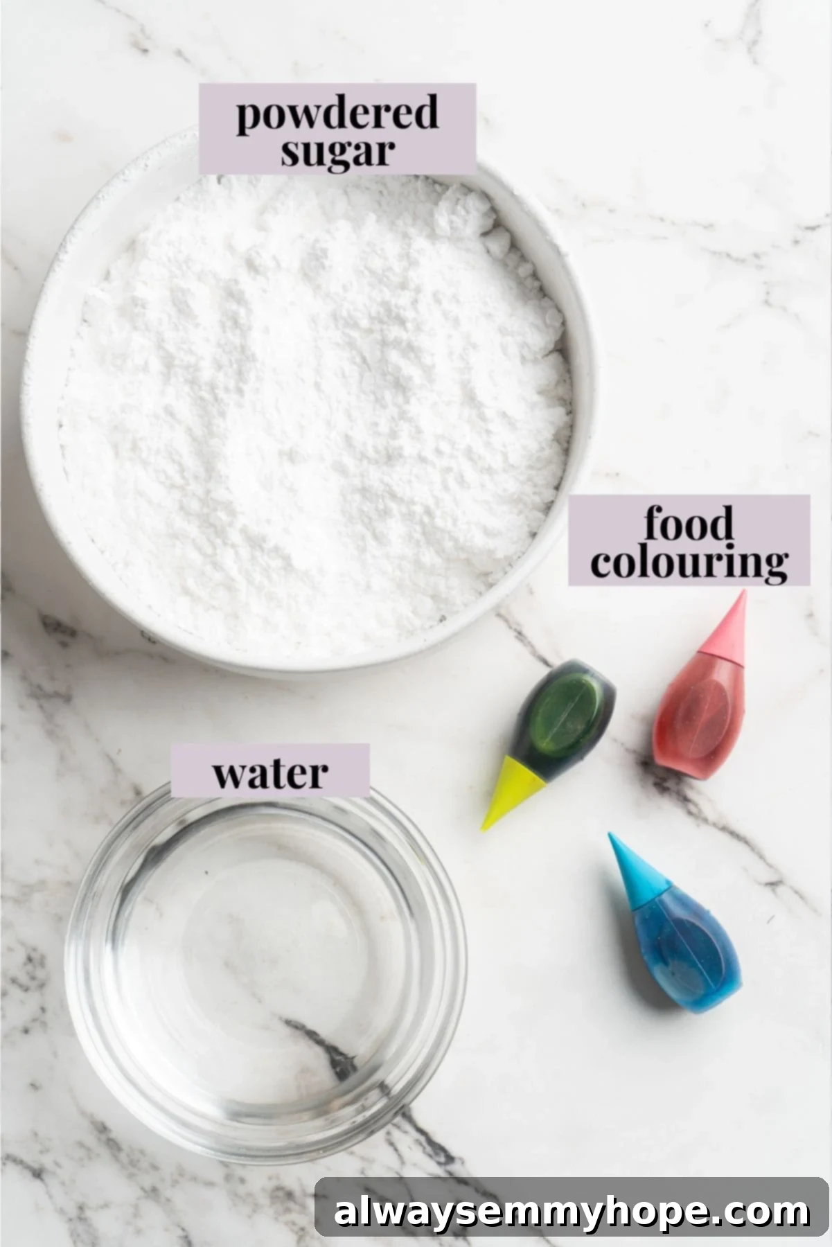Overhead shot of simple ingredients for homemade sprinkles: powdered sugar, water, and natural food coloring, neatly arranged on a white surface with descriptive labels.