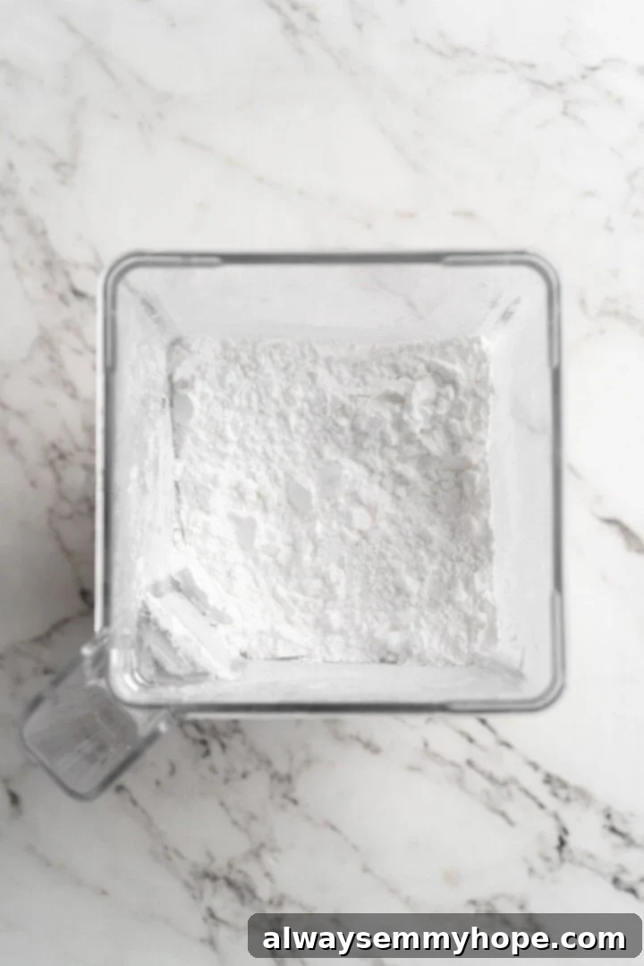 Homemade powdered sugar in jar of blender