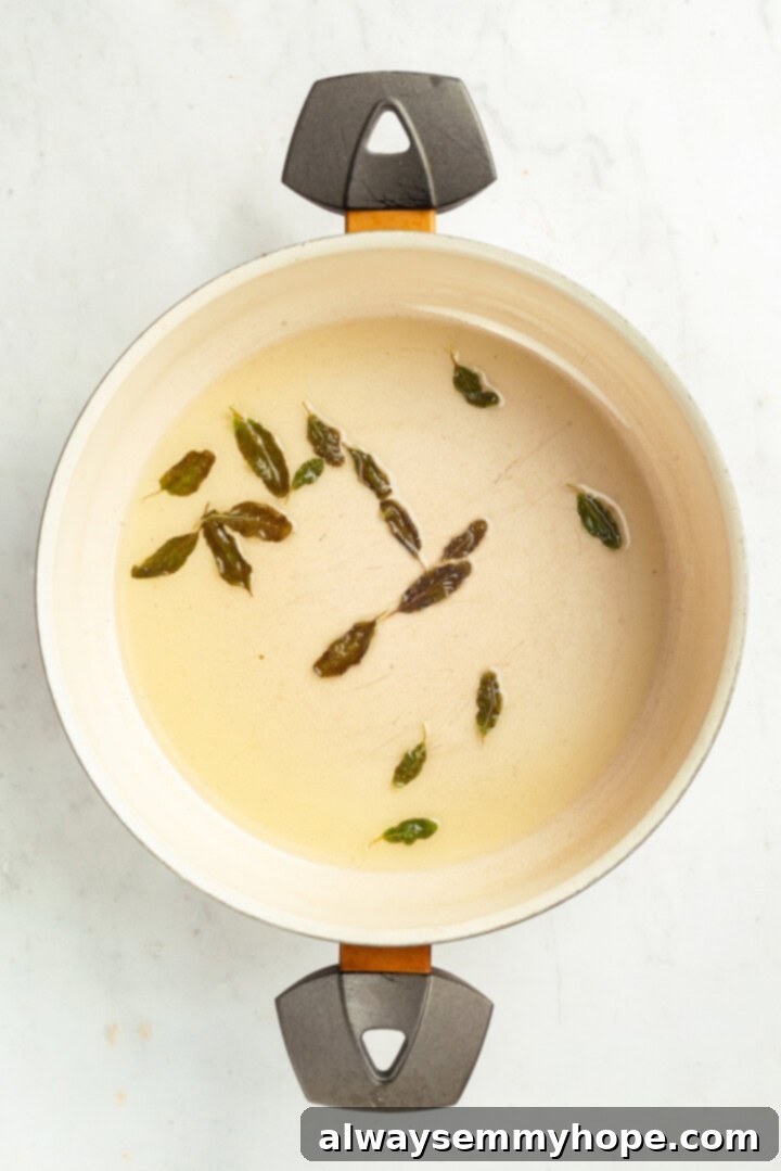Fresh sage leaves cooking in olive oil until crispy