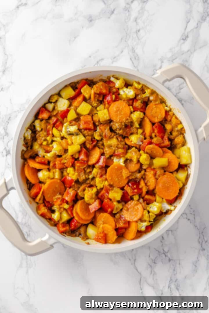 Vegetable korma is a rich and creamy Indian curry loaded with warm spices and tender veggies. It’s absolutely decadent and so easy to make! Vegetables in pot for korma