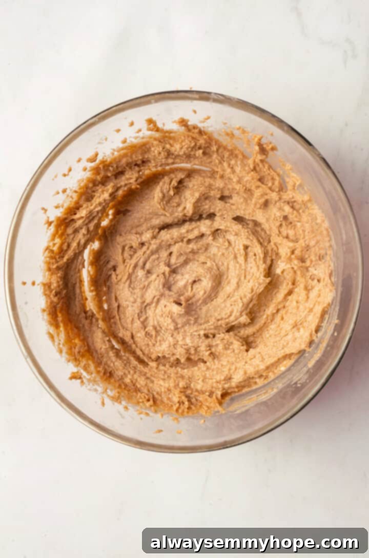 Creamed vegan butter and sugar in a mixing bowl, light and fluffy
