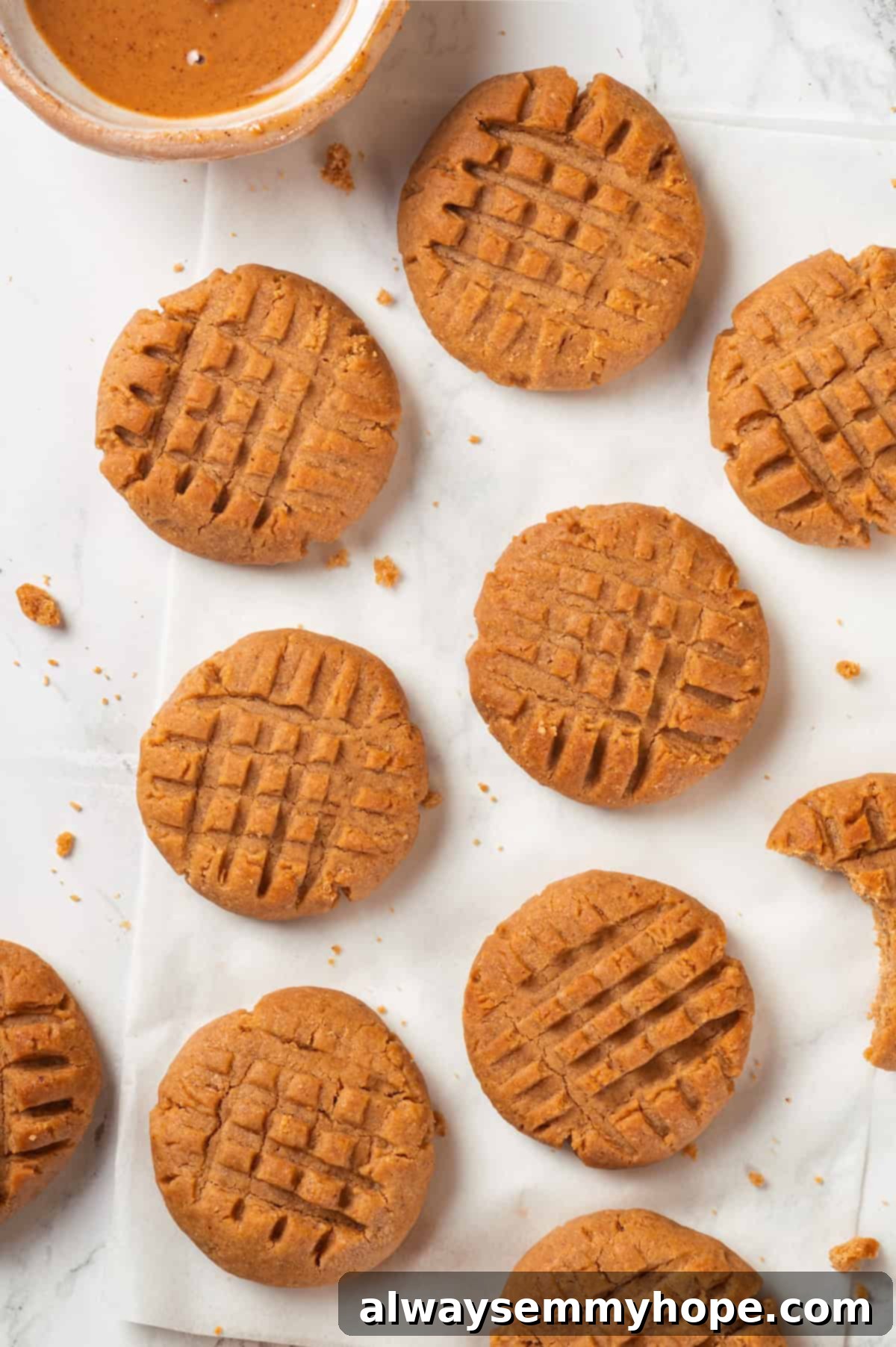 Overhead close-up view of perfectly baked chewy vegan peanut butter cookies on a cooling rack