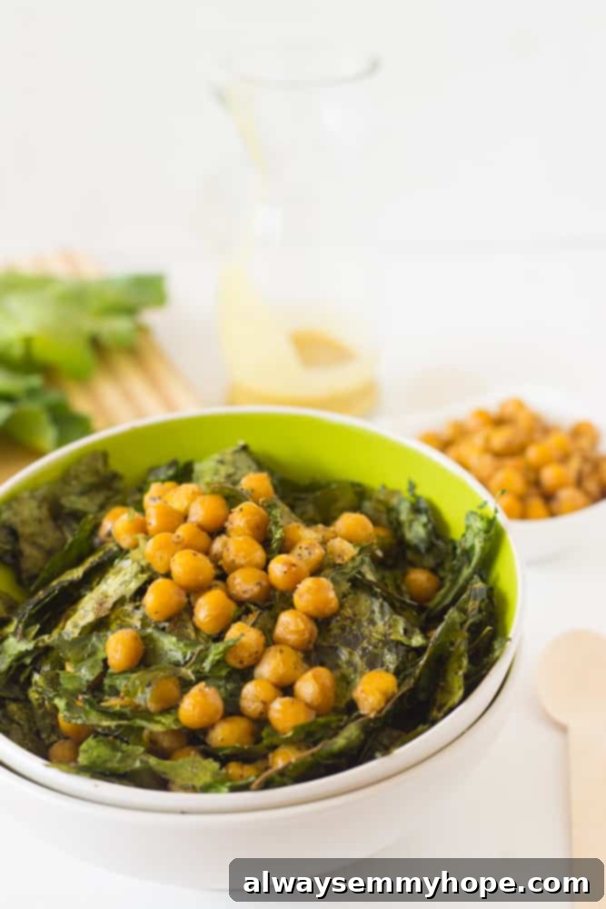 Vibrant Kale & Chickpea Salad with Zesty Lemon Poppyseed 5 Green bowl full of Crunchy Kale & Chickpea Salad.