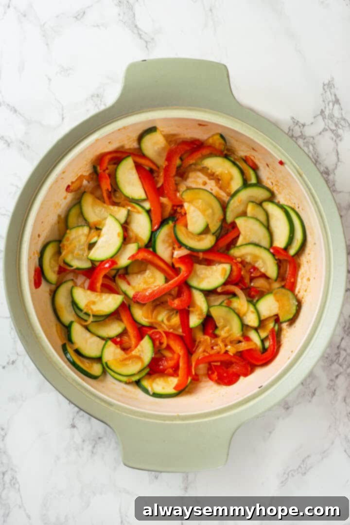 This easy Thai drunken noodles recipe is a quick stir-fry dinner perfect for a weeknight. They're sweet, savoury, spicy—and vegan too! Stir fried zucchini and peppers in skillet