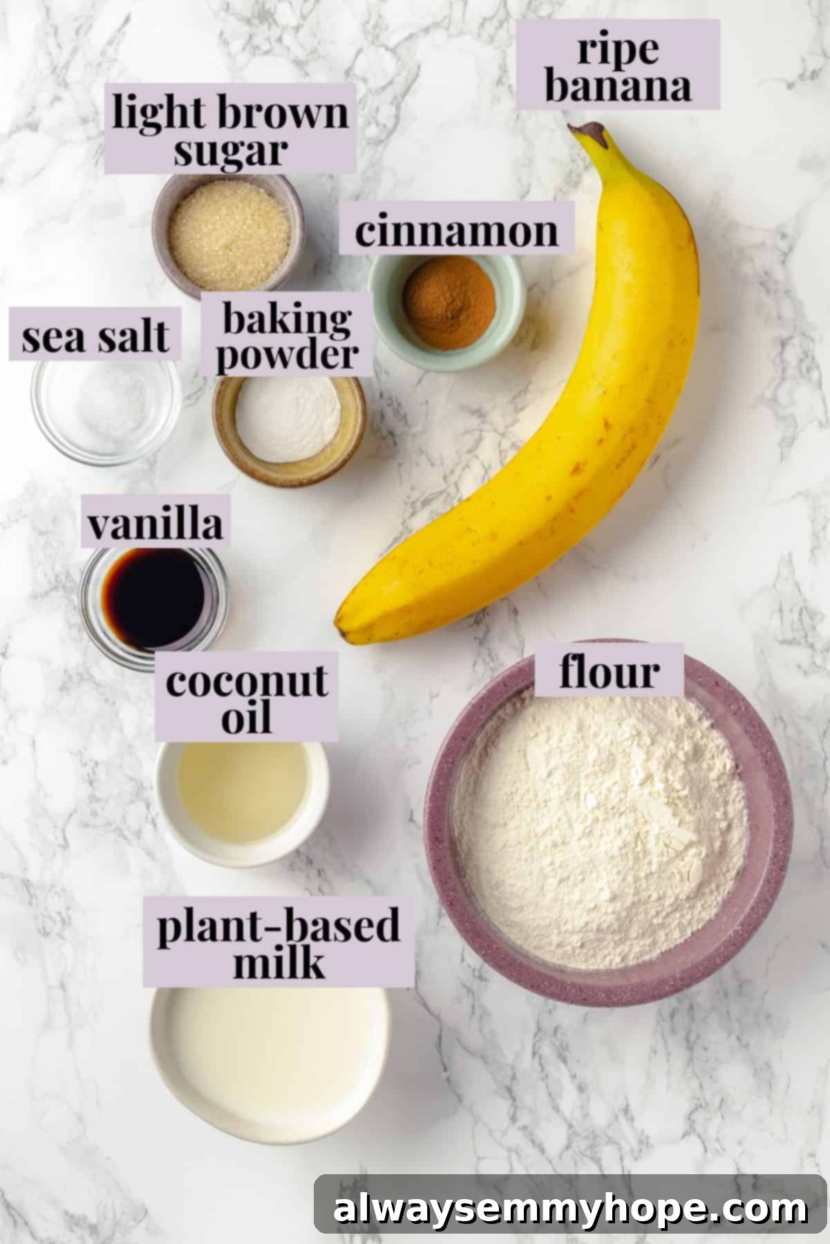 Overhead view of various ingredients for banana pancakes laid out with labels on a wooden surface