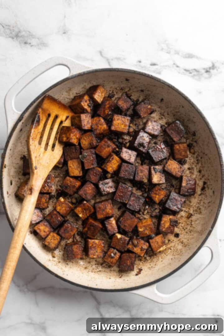 This brown stew tofu recipe is a flavourful, hearty dinner inspired by traditional Jamaican cooking—but with a vegan twist! Cooking cubes of marinated tofu in a hot skillet until browned