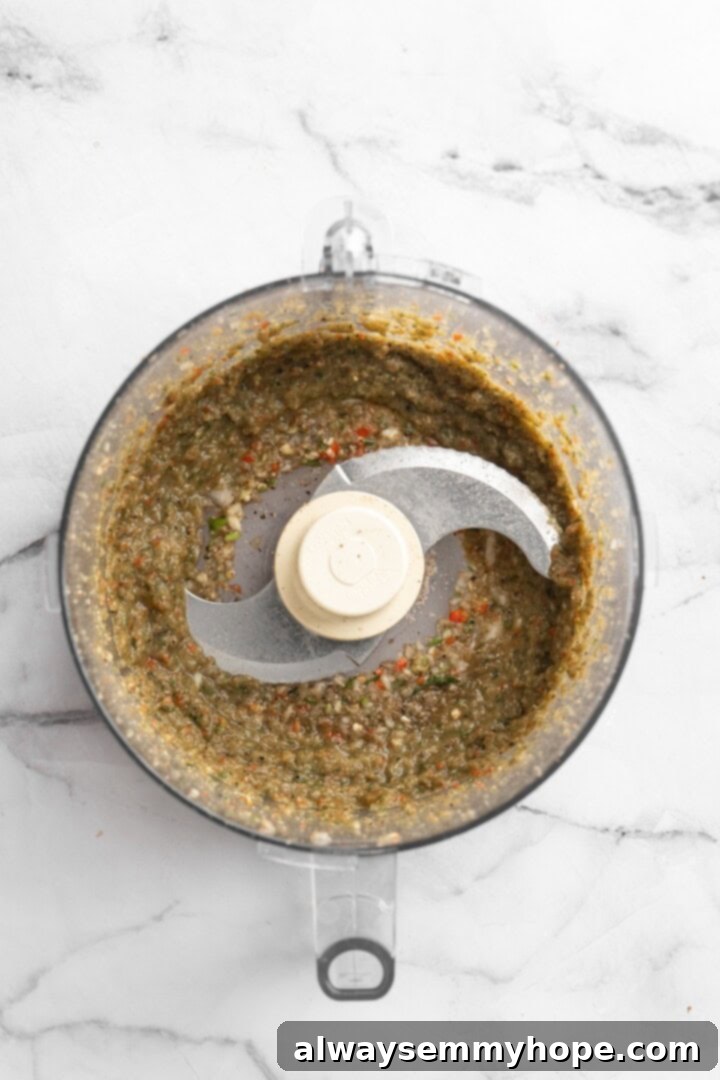 Mixing seasonings in food processor for vegan Jamaican patty filling