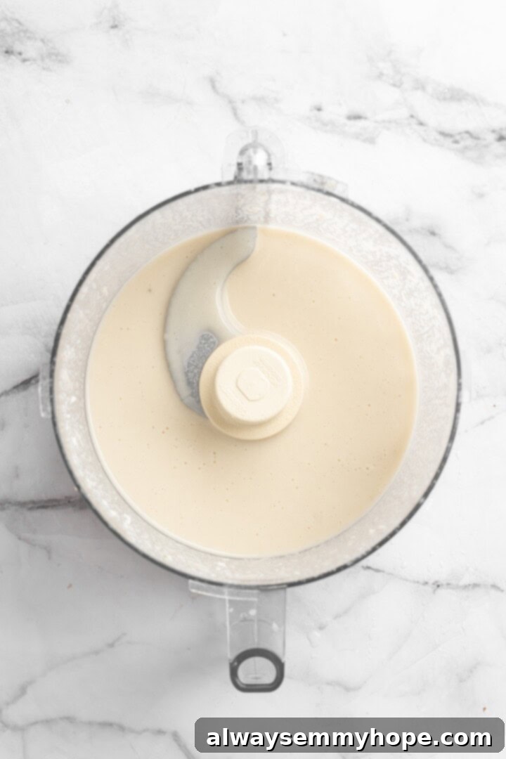 Mixing panade in food processor, a blend of bread and vegetable stock