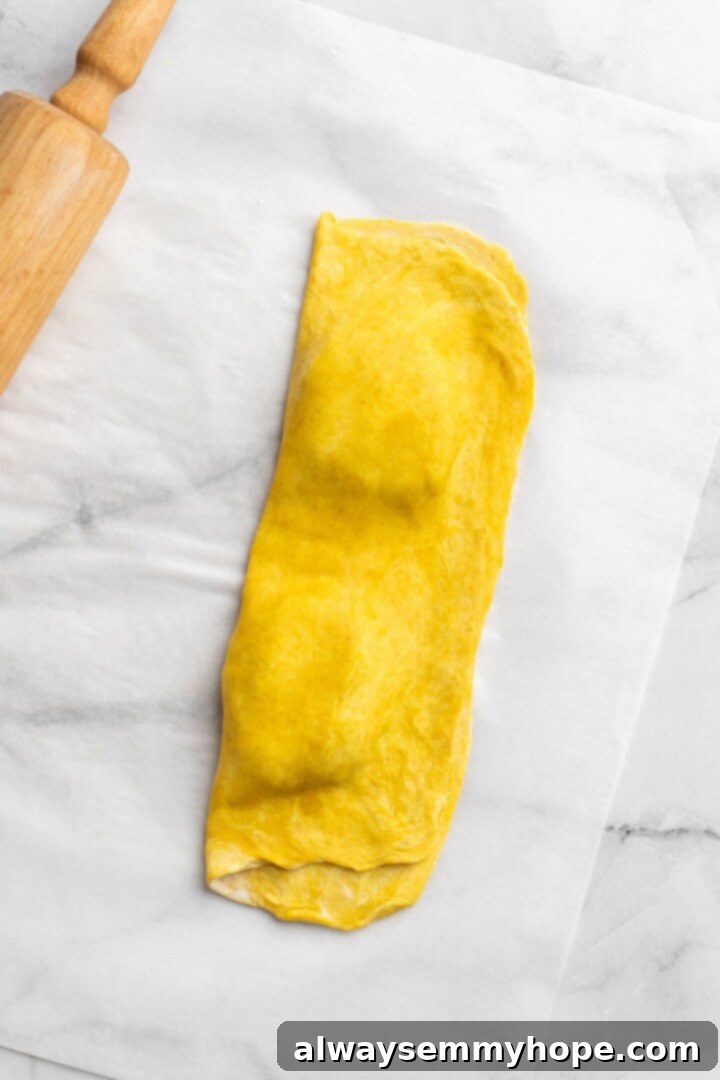 Forming vegan Jamaican patties by folding dough over filling and crimping edges