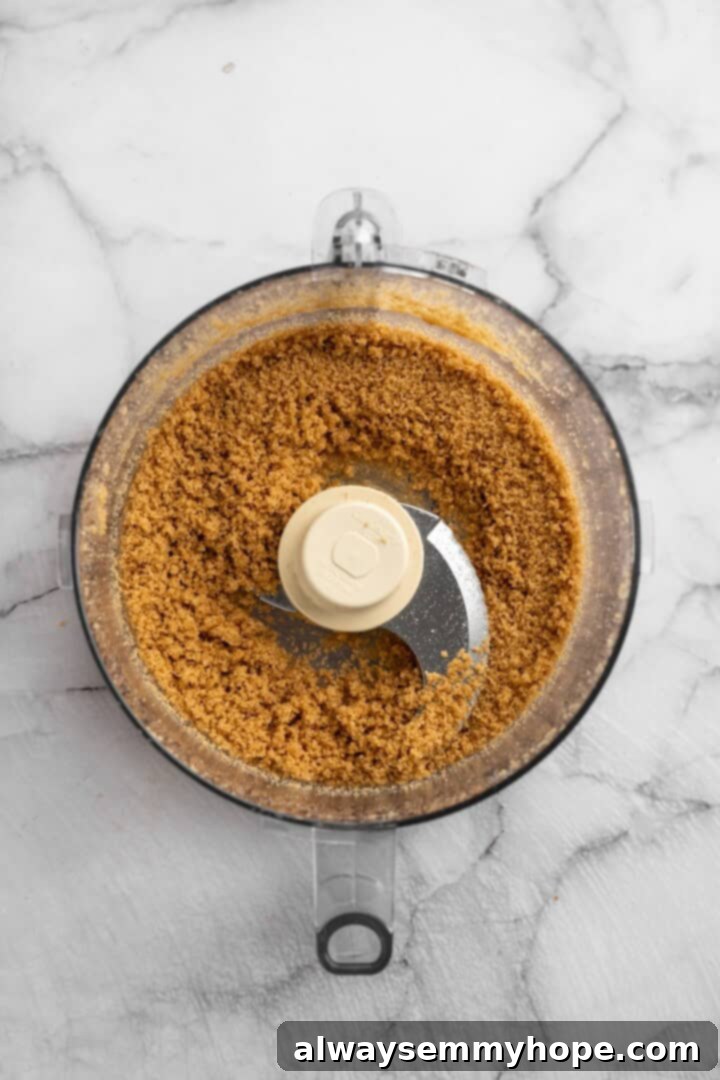 Vegan mini cheesecakes are the perfect two-bite dessert, with a rich, creamy cheesecake filling no one can resist. So easy to make too! Preparing the delicious graham cracker crust. Graham cracker crust mixture in a food processor bowl, ready to be pressed.