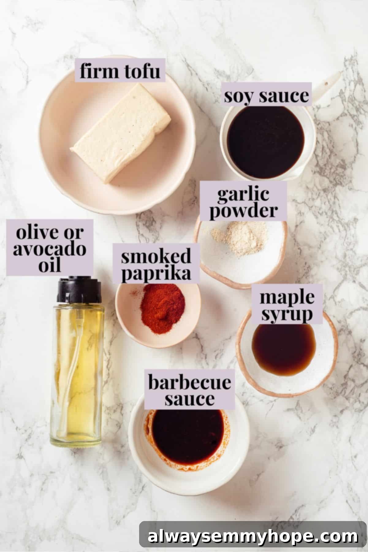 Key Ingredients for Flavorful Tofu Bacon A selection of fresh ingredients laid out, including a block of firm tofu, bottles of soy sauce, maple syrup, barbecue sauce, and small bowls of smoked paprika and garlic powder, ready to make vegan tofu bacon.