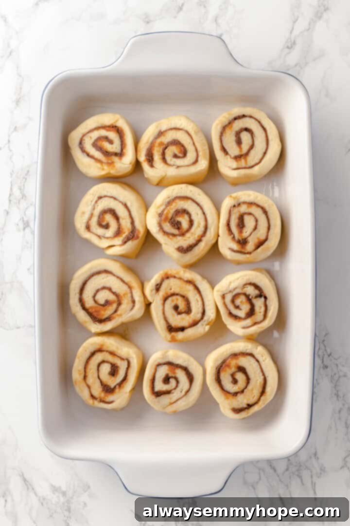 Vegan honey buns in baking dish before rising