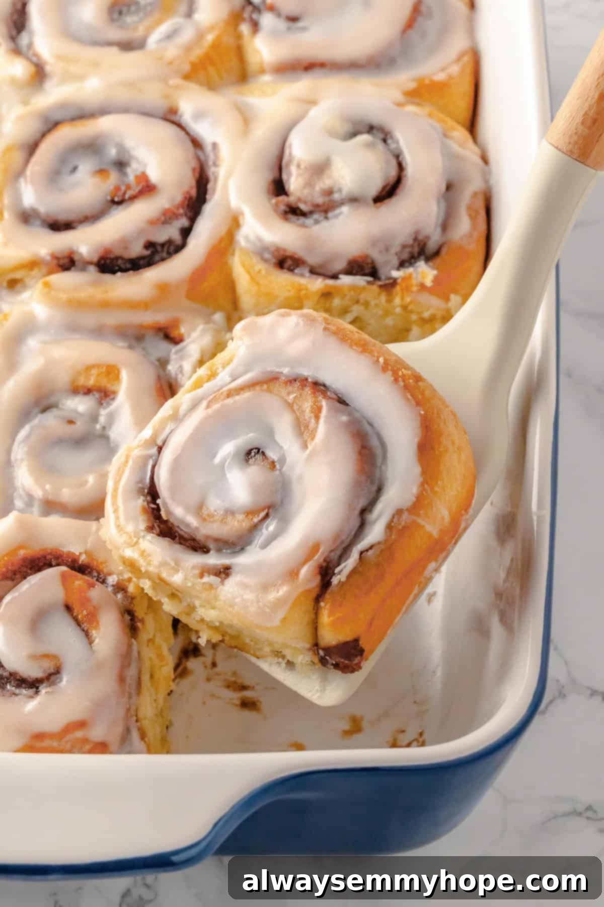 Lifting vegan honey bun from baking dish