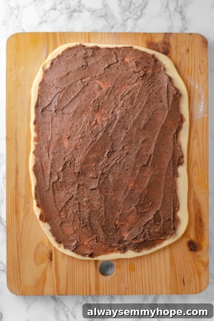 Cinnamon sugar spread on dough