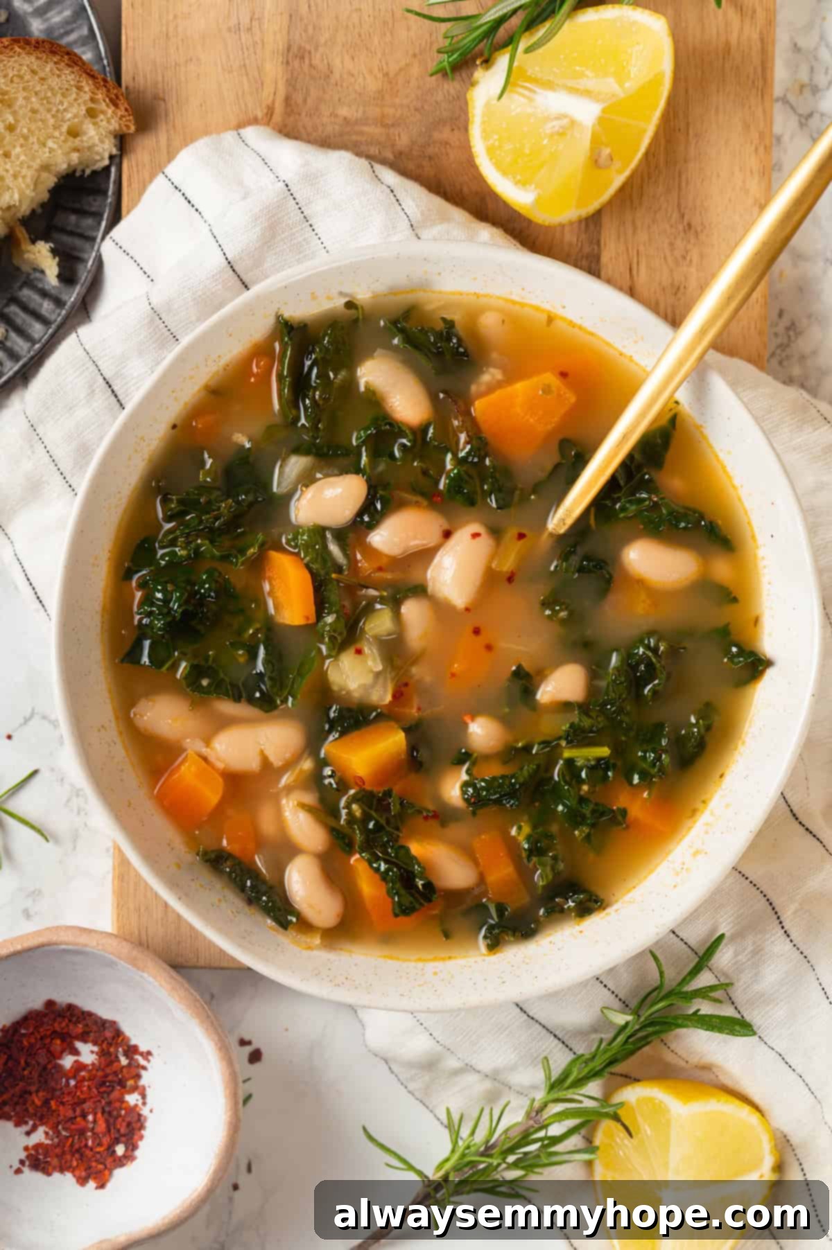 Overhead view of kale soup in bowl with spoon