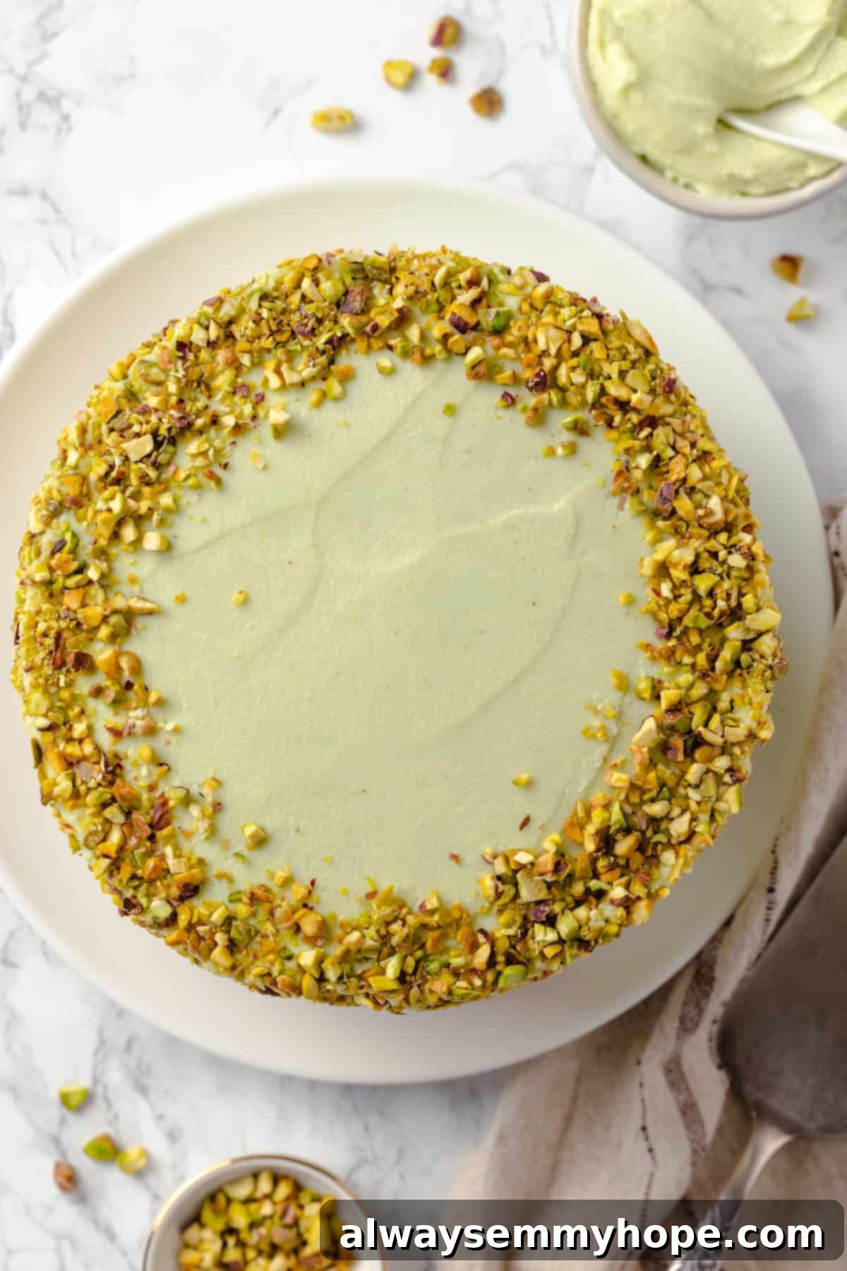 Overhead view of pistachio cake on platter