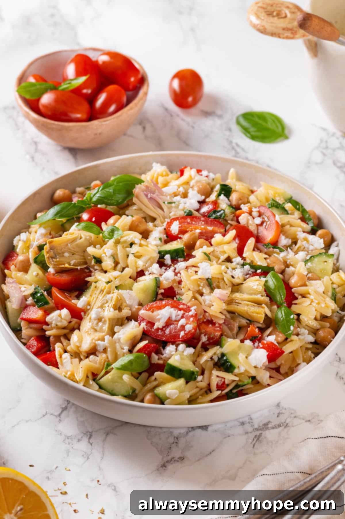 Orzo pasta salad in white bowl