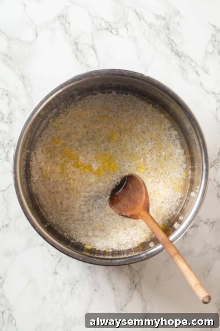 Stirring ingredients for jasmine rice in Instant Pot