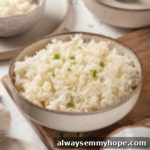 Bowl of Instant Pot jasmine rice with green onions for garnish