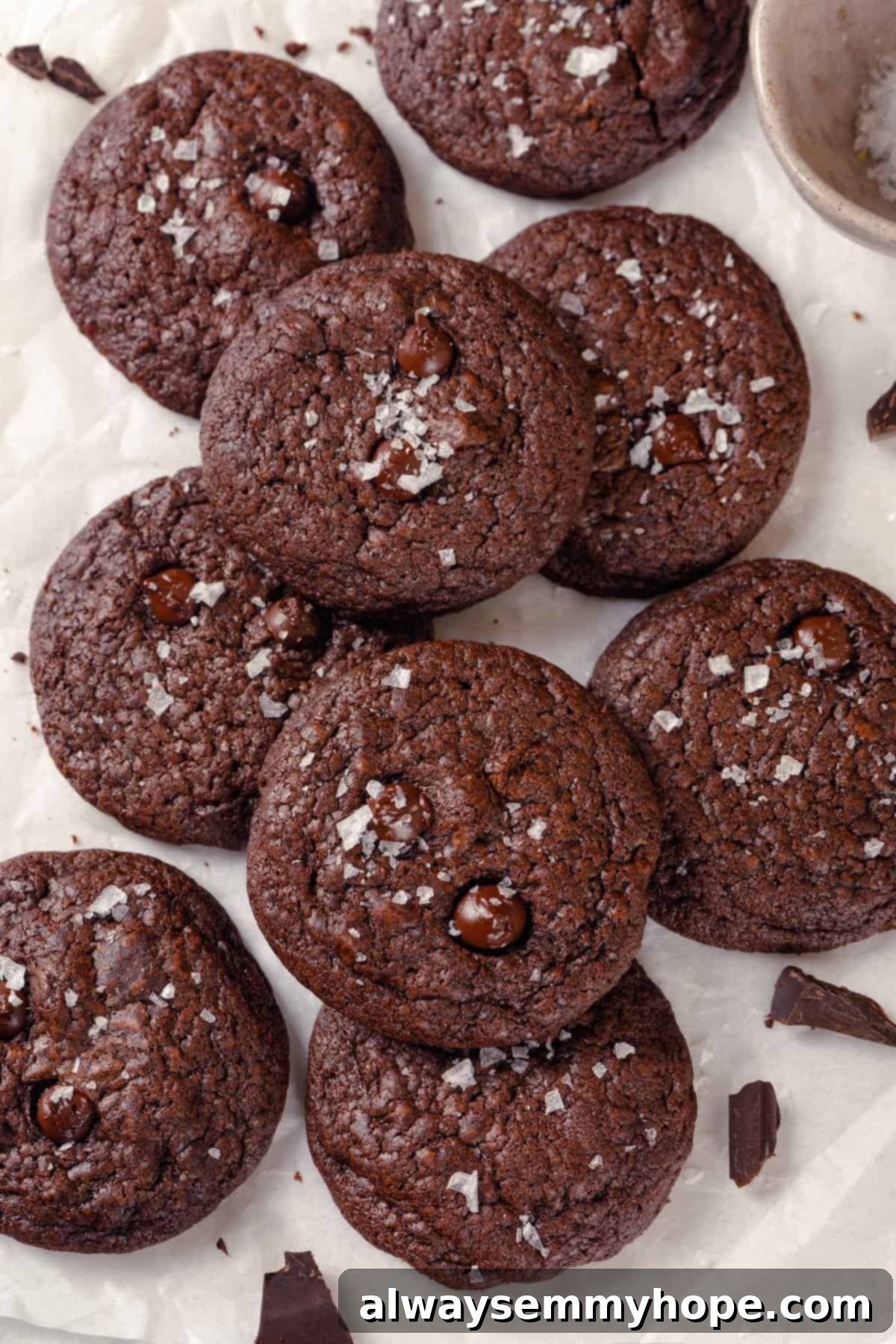 Overhead view of brownie cookies piled on parchment paper