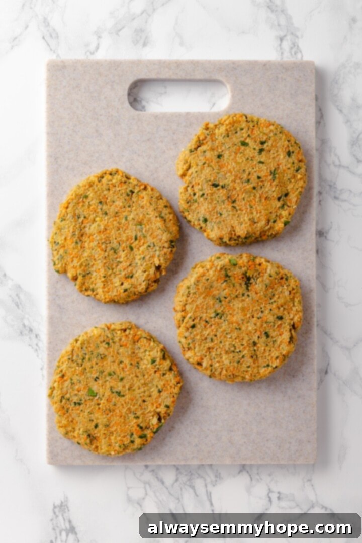 Overhead view of falafel burger patties after being perfectly shaped and ready for cooking.
