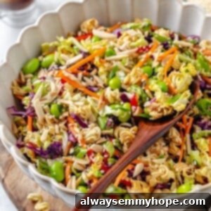 Crispy Ramen Noodle Salad 2 Wooden spoon scooping ramen noodle salad from bowl