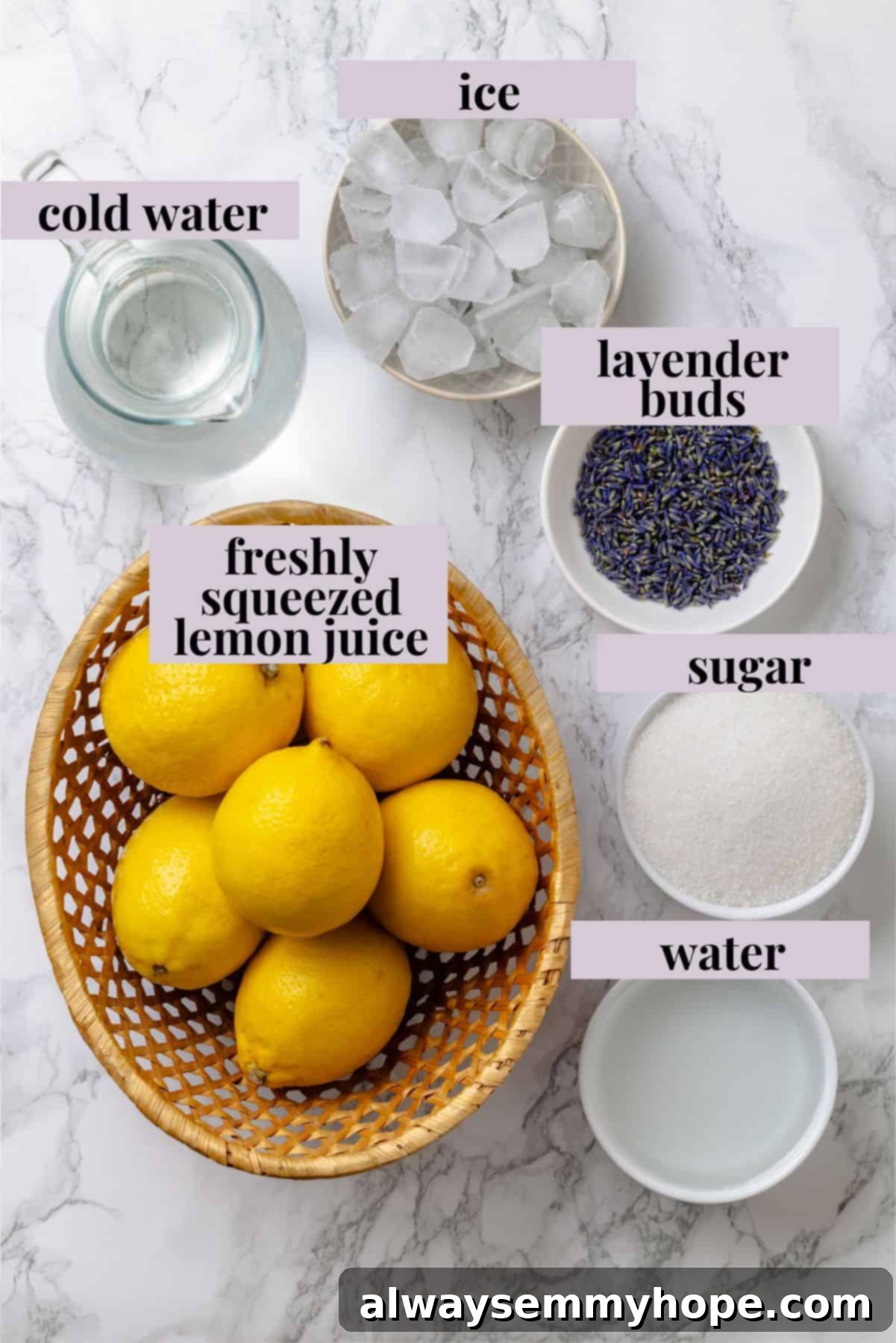 Overhead view of fresh ingredients for homemade lavender lemonade including lemons, sugar, and dried lavender buds
