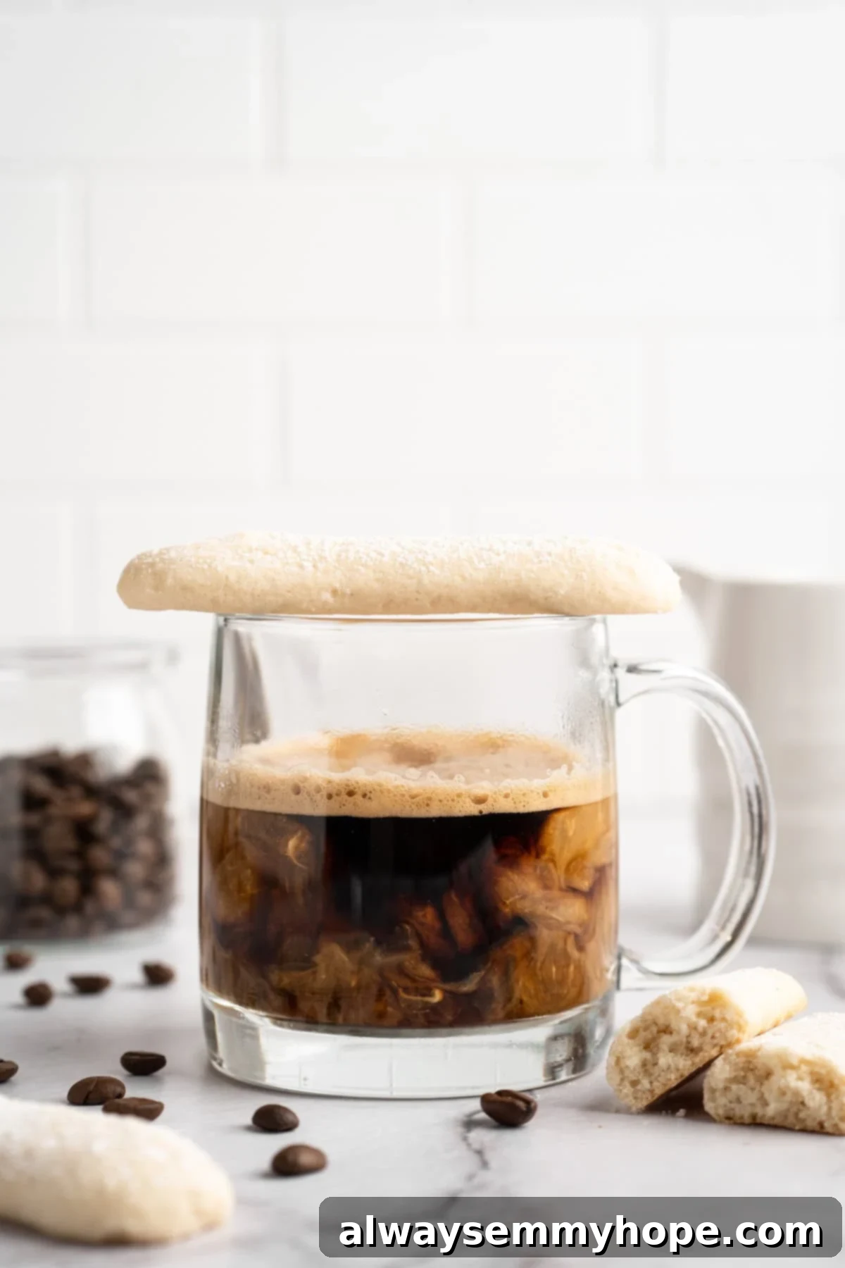 Vegan ladyinger set on rim of glass coffee mug