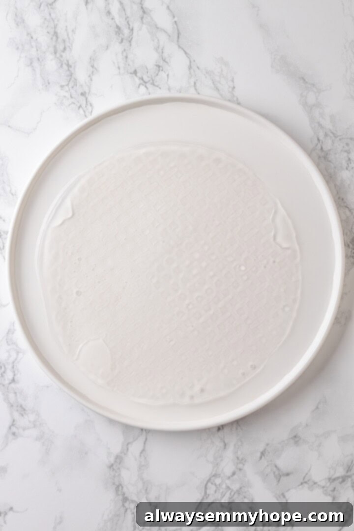 Rice paper is the secret for ultra crispy vegan bacon! This recipe is smoky, sweet, and savoury, and it's incredibly easy to make too. Soaking rice paper in water to soften it