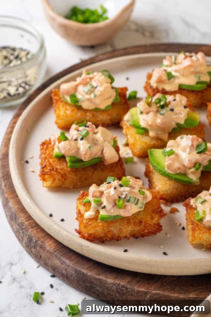 Plate of crispy rice cakes topped with vegan spicy tuna