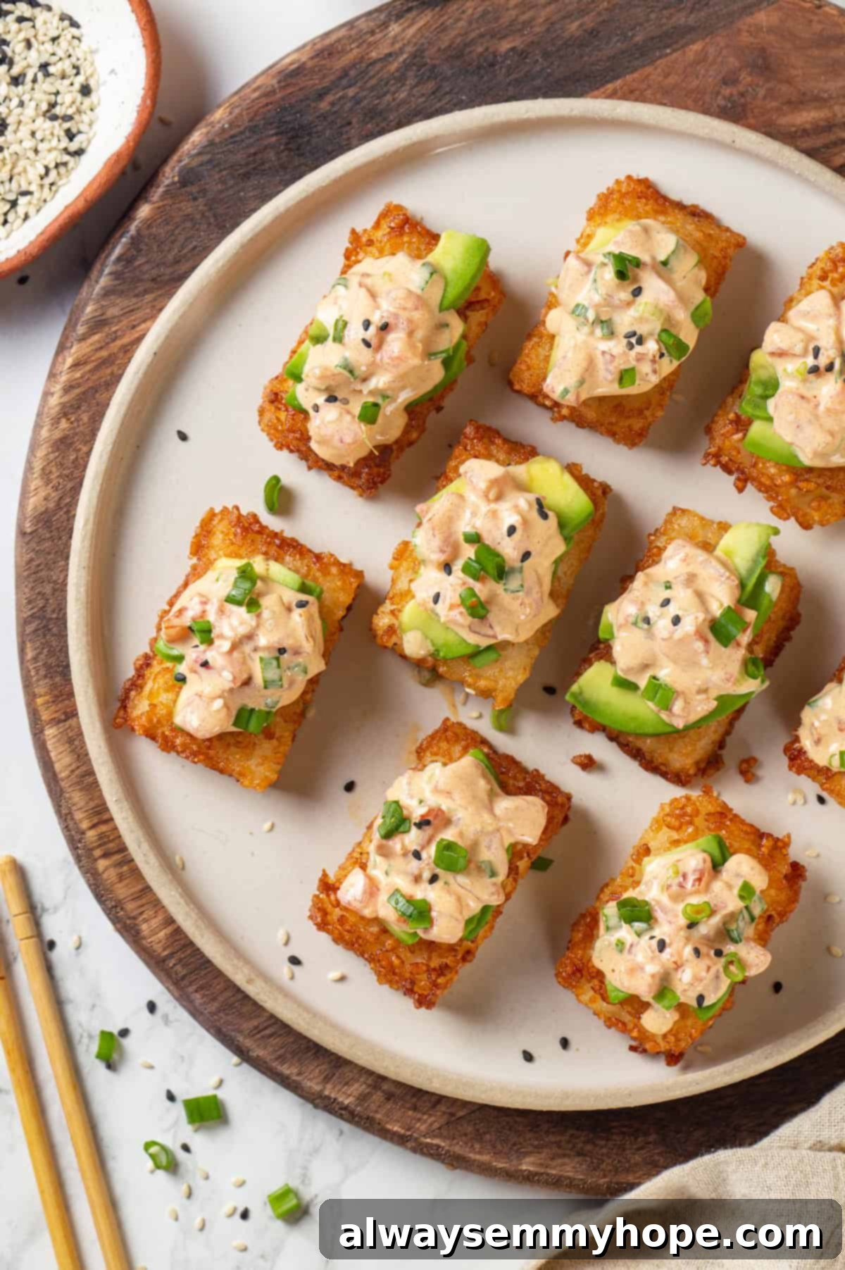 Overhead view of crispy rice cakes topped with spicy vegan tuna