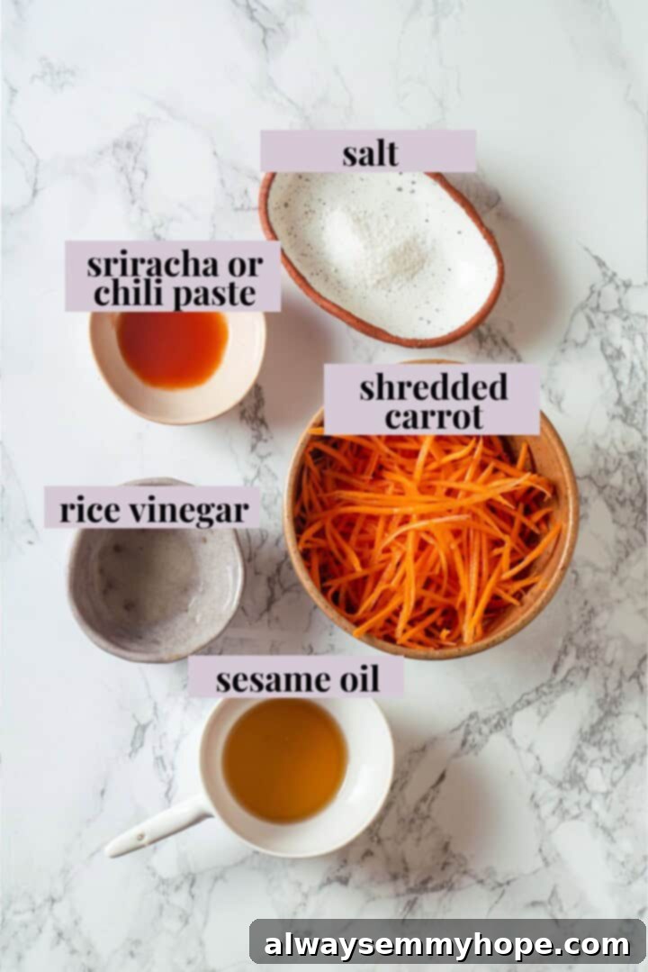 This inari sushi recipe tucks tangy sushi rice into tofu pockets with toppings like avocado, spicy carrots, and tofu scramble. Easy and fun! Overhead view of ingredients for spicy carrot topping