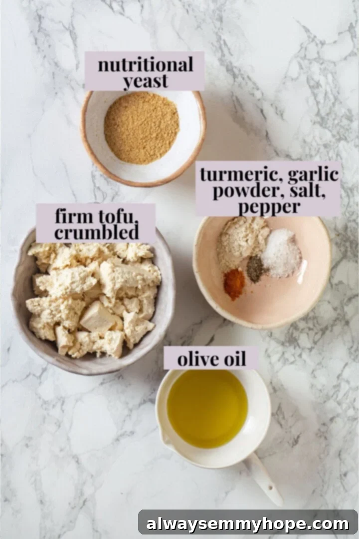 This inari sushi recipe tucks tangy sushi rice into tofu pockets with toppings like avocado, spicy carrots, and tofu scramble. Easy and fun! Overhead view of ingredients for tofu scramble