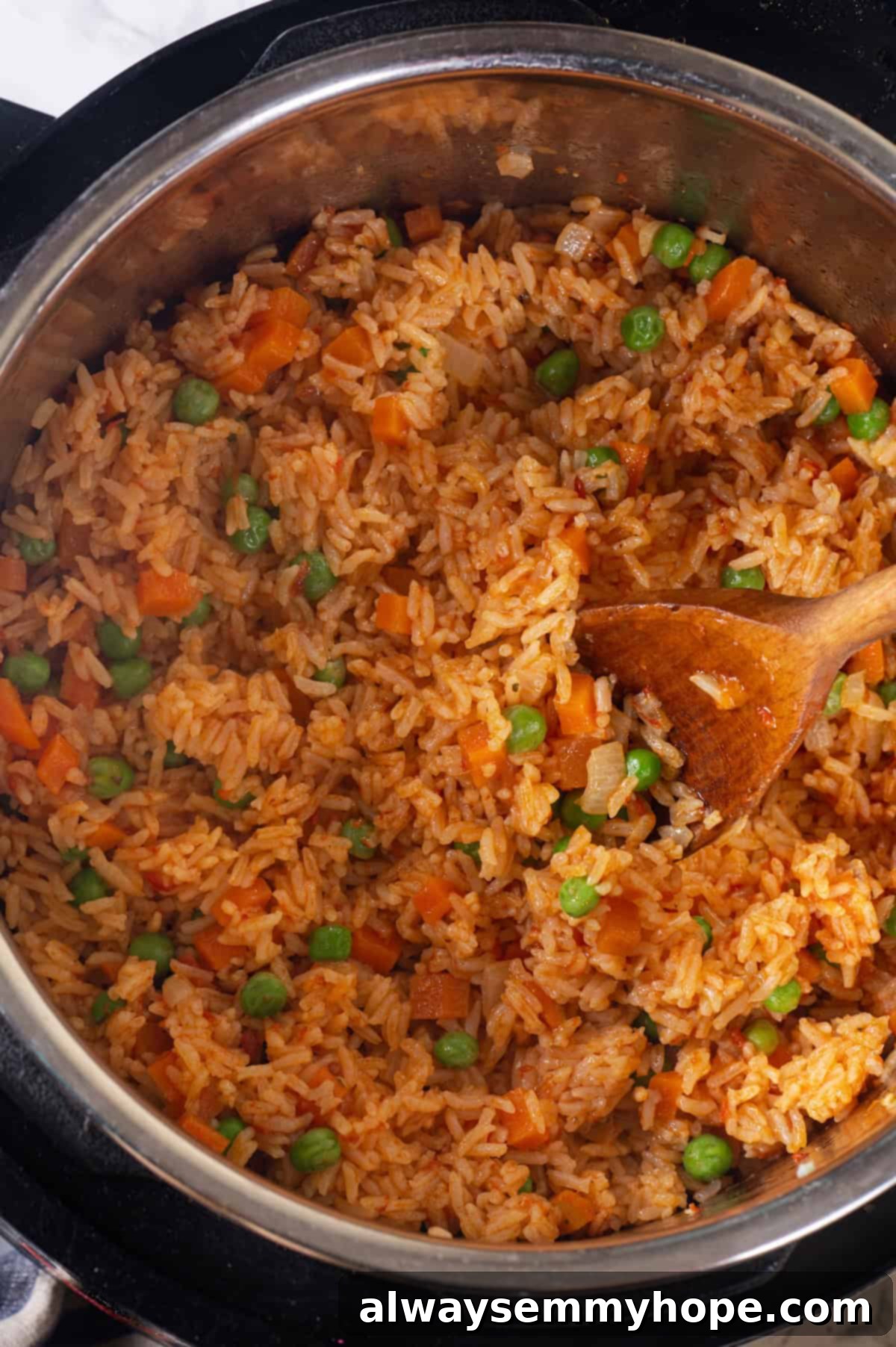 Instant Pot Mexican Rice is a total game-changer! It turns out perfectly cooked and fluffy every time. This easy recipe will be your go-to! Overhead view of Mexican rice in Instant Pot