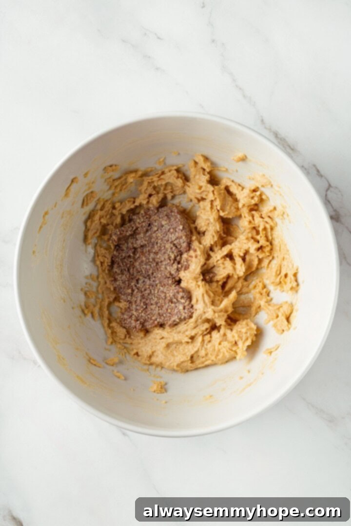A little bit like coffee cake, this Blueberry Buckle is loaded with berries, then topped with brown sugar cinnamon streusel. So delicious! Overhead view of creamed vegan butter, brown sugar, vanilla, and flax egg in a large mixing bowl.