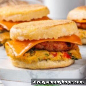 Vegan breakfast sandwich with omelet, sausage, and cheese