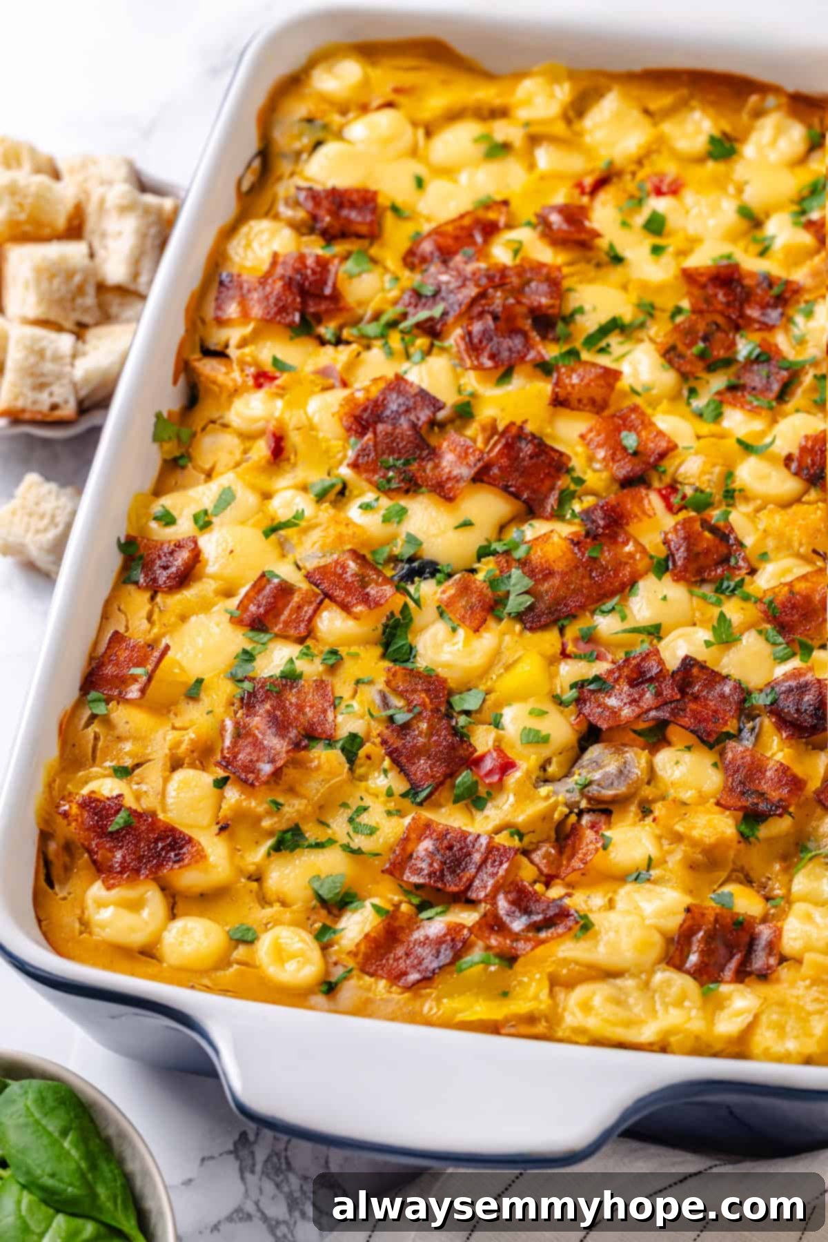 The full vegan overnight breakfast strata, baked to golden perfection, still in its baking dish, ready to be sliced and served.