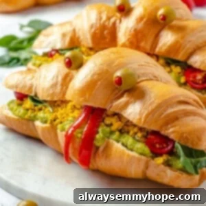 Spooky Monster Breakfast Sandwich 2 Two vegan monster breakfast sandwiches on marble board