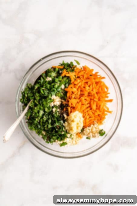 Step-by-step instructions on how to make vegan potstickers at home! These Chinese dumplings are filled with tofu and veggies. So good! Overhead view of a glass bowl containing finely minced vegetables and pressed tofu, ready to be mixed into a savory potsticker filling.